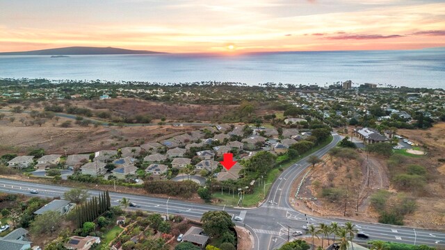 aerial view at dusk with a water view