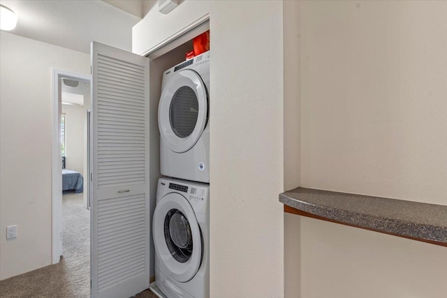 31 E Kuu Aku Ln Unit 206, Lahaina, HI 96761 - laundry room with stacked washer / drying machine and carpet flooring