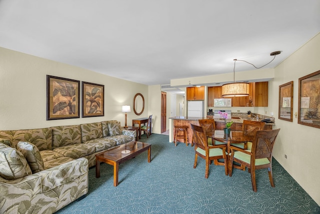 living area featuring carpet