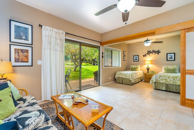 tiled bedroom with access to outside and ceiling fan