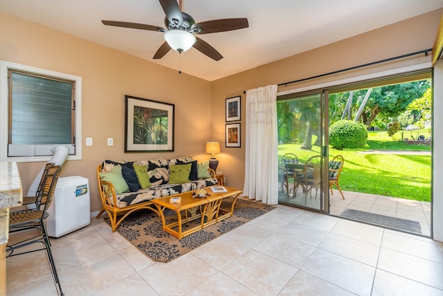 living room with light tile patterned floors and ceiling fan