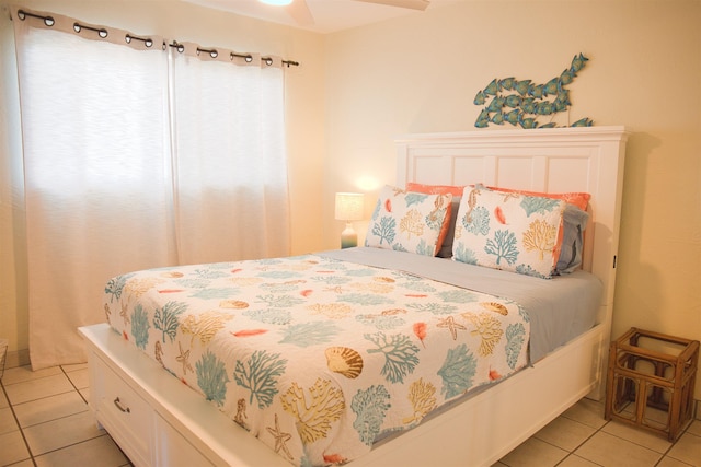 tiled bedroom with ceiling fan