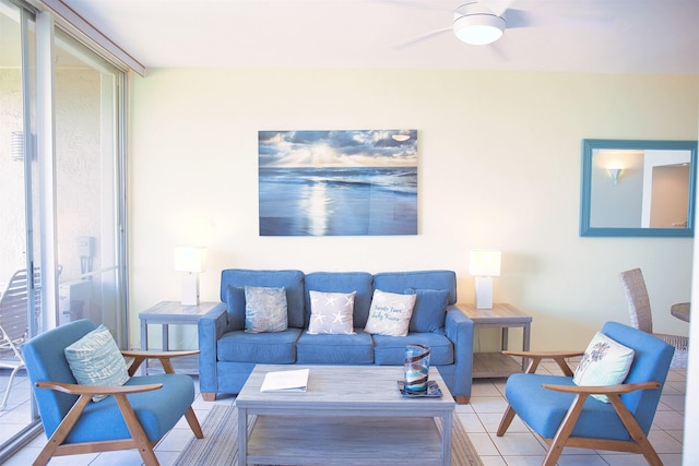 living room featuring ceiling fan and light tile patterned floors