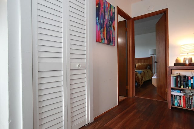 hallway with dark wood-type flooring