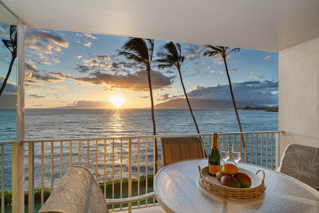 2430 S Kihei Rd Unit 411, Kihei, HI 96753 - balcony at dusk featuring a water view