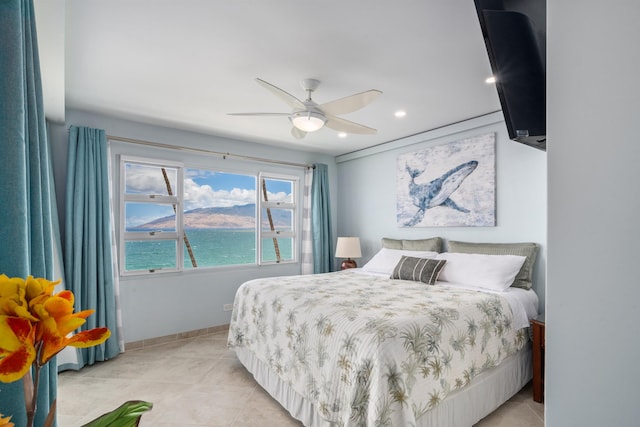 2430 S Kihei Rd Unit 411, Kihei, HI 96753 - bedroom with baseboards, recessed lighting, a water view, light tile patterned floors, and a ceiling fan