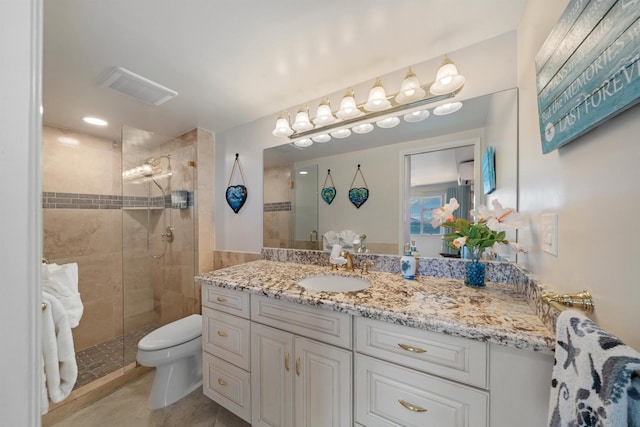 2430 S Kihei Rd Unit 411, Kihei, HI 96753 - bathroom featuring vanity, a tile shower, toilet, and tile patterned flooring