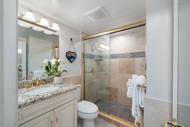 2430 S Kihei Rd Unit 411, Kihei, HI 96753 - full bath featuring a shower stall, vanity, toilet, and tile patterned floors