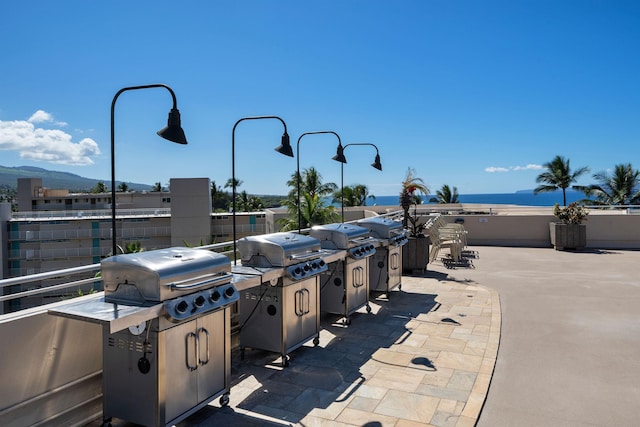2430 S Kihei Rd Unit 411, Kihei, HI 96753 - view of patio / terrace with area for grilling and a water view