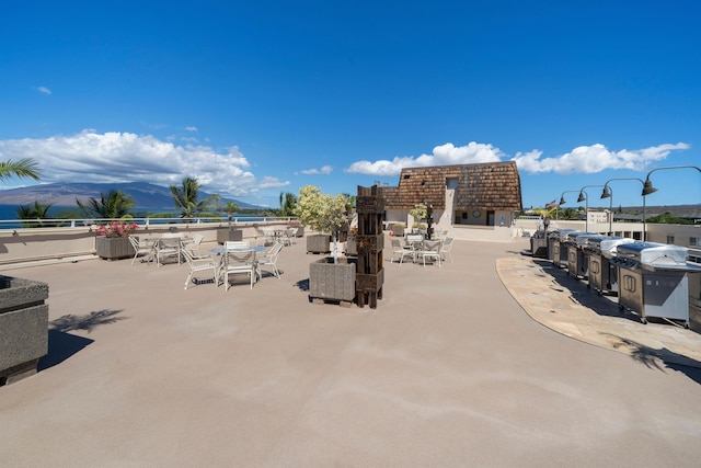 2430 S Kihei Rd Unit 411, Kihei, HI 96753 - view of property's community with outdoor dining area and a mountain view