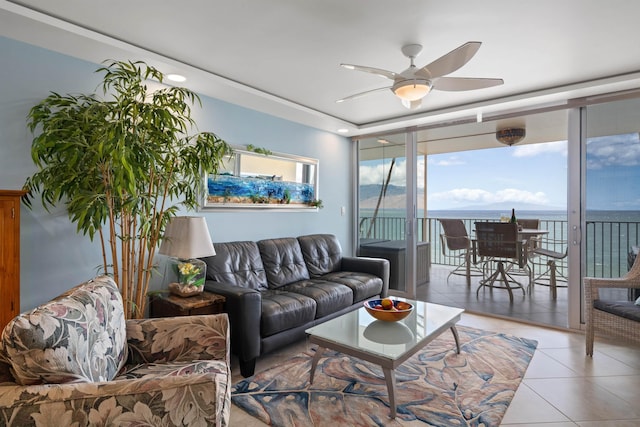2430 S Kihei Rd Unit 411, Kihei, HI 96753 - tiled living area featuring a ceiling fan and a wall of windows