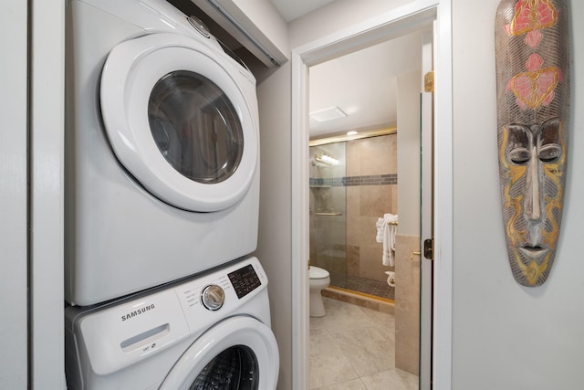 2430 S Kihei Rd Unit 411, Kihei, HI 96753 - laundry room with stacked washer and clothes dryer and light tile patterned flooring