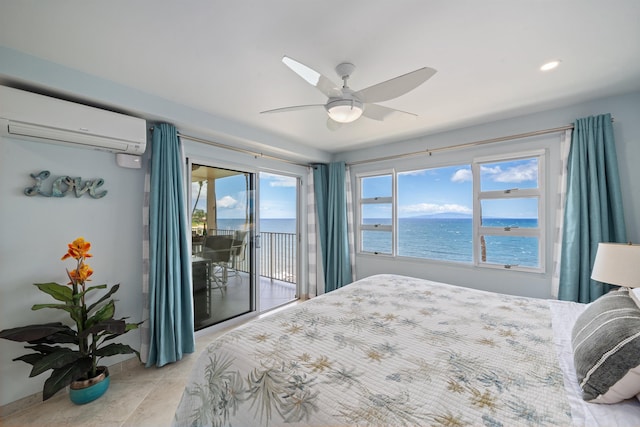 2430 S Kihei Rd Unit 411, Kihei, HI 96753 - bedroom featuring an AC wall unit, access to outside, a water view, ceiling fan, and recessed lighting