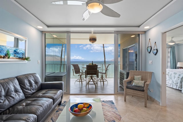 2430 S Kihei Rd Unit 411, Kihei, HI 96753 - living room with ceiling fan, healthy amount of natural light, light tile patterned flooring, recessed lighting, and a water view