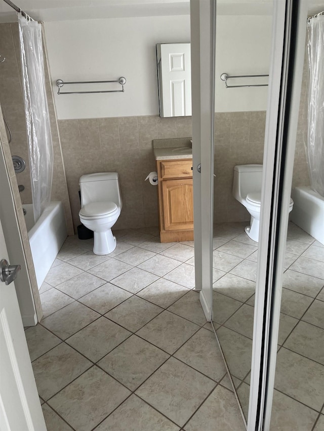 full bathroom featuring shower / bath combination with curtain, tile walls, and toilet