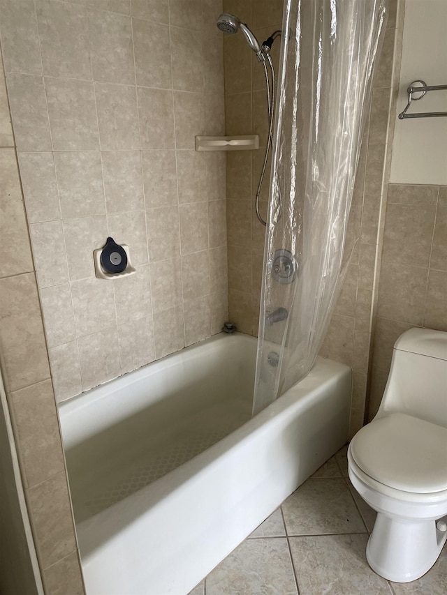 bathroom with tile patterned floors, shower / tub combo with curtain, and toilet