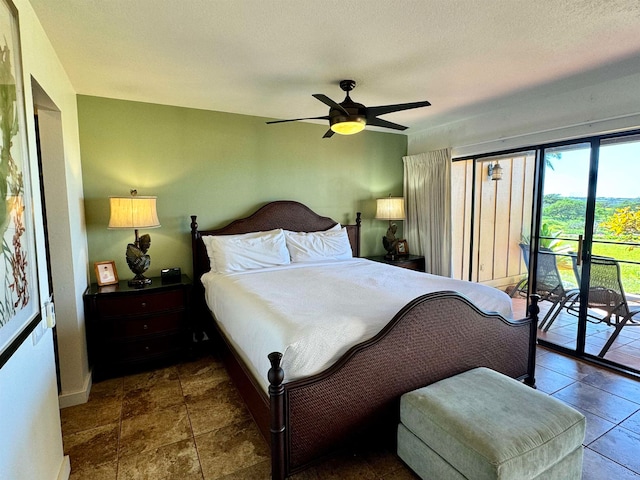 tiled bedroom with ceiling fan, a textured ceiling, and access to exterior