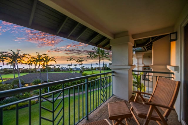 view of balcony at dusk