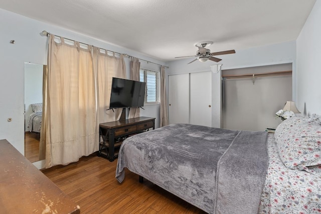 bedroom with ceiling fan and wood-type flooring