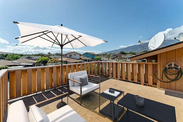 view of patio / terrace featuring a mountain view and an outdoor hangout area