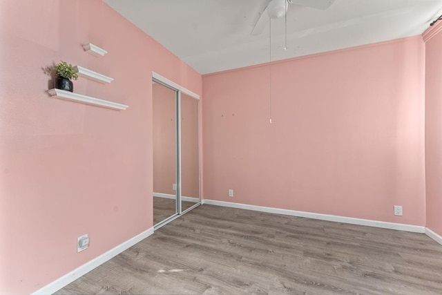 empty room featuring light hardwood / wood-style floors and ceiling fan