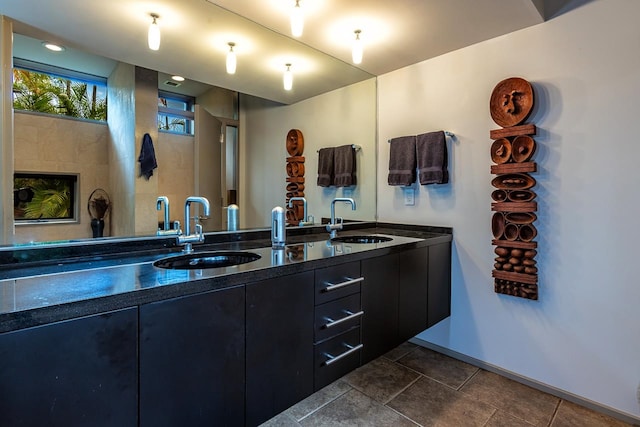 bathroom with tile patterned floors and double vanity