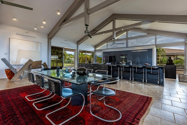 dining space featuring beam ceiling, high vaulted ceiling, and ceiling fan