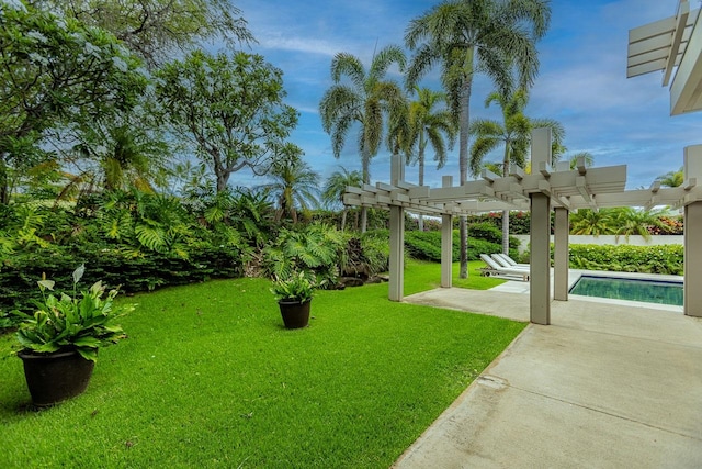 view of yard with a pergola and a patio area