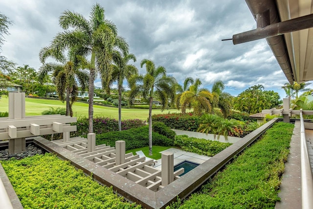 surrounding community featuring a patio and a lawn