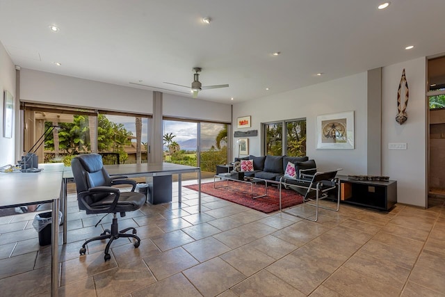 living room with ceiling fan and light tile patterned flooring