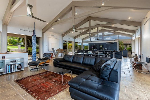 living room with ceiling fan, high vaulted ceiling, beam ceiling, and tile patterned flooring