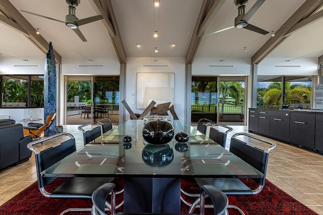 dining space with ceiling fan, light tile patterned flooring, and a healthy amount of sunlight