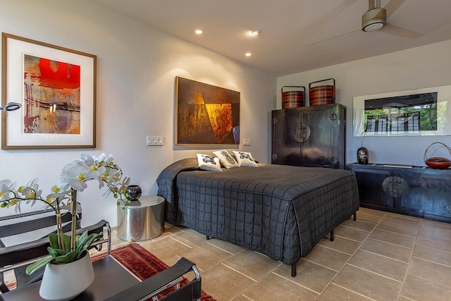 bedroom with ceiling fan and tile patterned floors