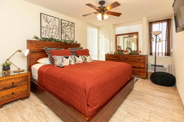 2737 S Kihei Rd Unit 311, Kihei, HI 96753 - bedroom featuring a wall unit AC, ceiling fan, and light tile patterned flooring