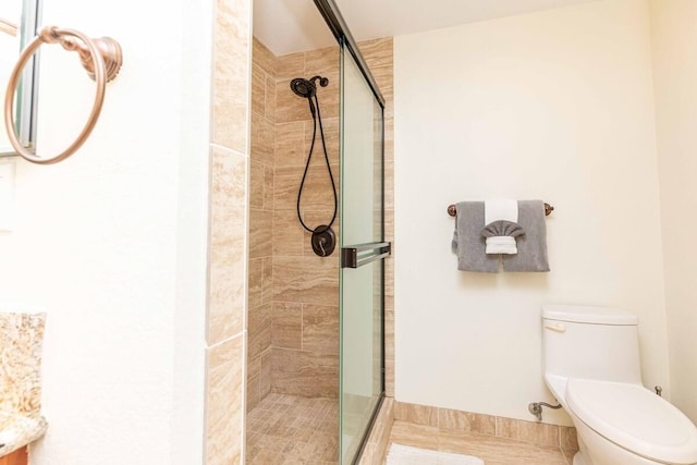 2737 S Kihei Rd Unit 311, Kihei, HI 96753 - bathroom featuring a stall shower, toilet, and tile patterned floors