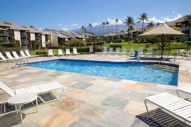 2737 S Kihei Rd Unit 311, Kihei, HI 96753 - community pool featuring a patio, fence, and a residential view