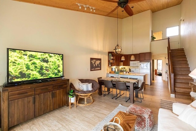 2737 S Kihei Rd Unit 311, Kihei, HI 96753 - living area with a towering ceiling, stairs, ceiling fan, wood ceiling, and healthy amount of natural light