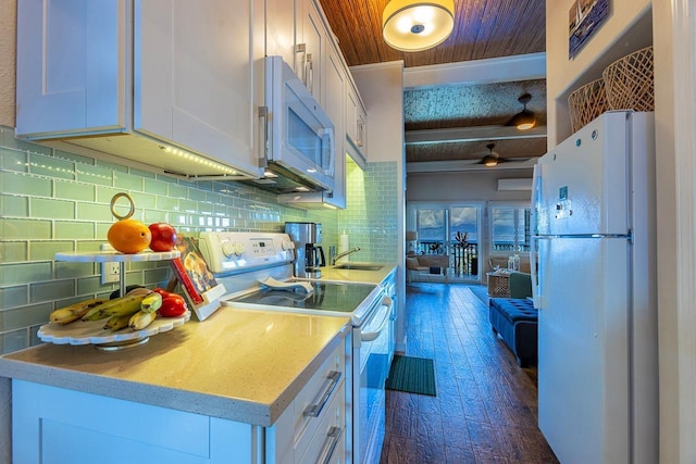 kitchen featuring wooden ceiling, sink, white cabinets, and white appliances