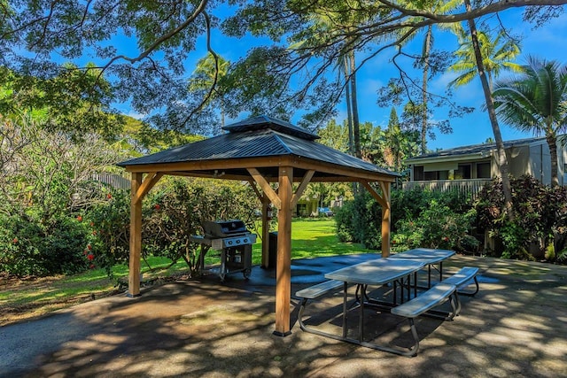 surrounding community with a gazebo and a patio area