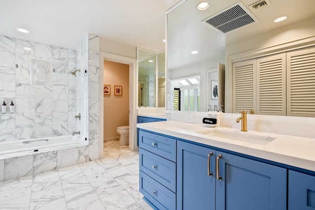 bathroom with toilet and vanity