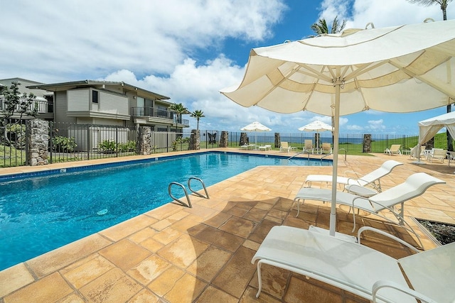 view of swimming pool with a patio