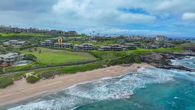 birds eye view of property featuring a view of the beach and a water view