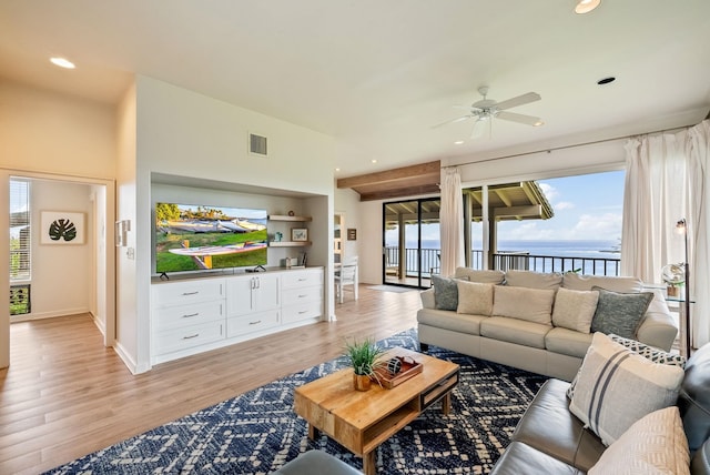 living room with light wood-type flooring and ceiling fan