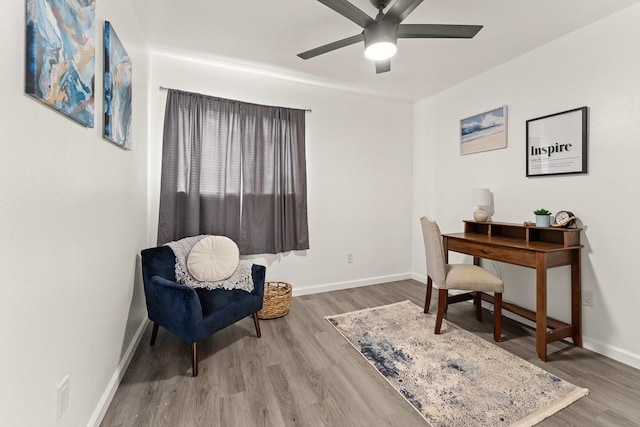 office with wood finished floors, a ceiling fan, and baseboards