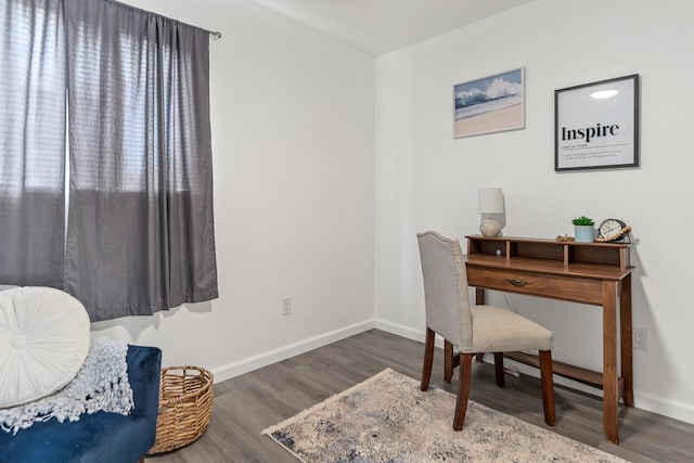 home office featuring wood finished floors and baseboards