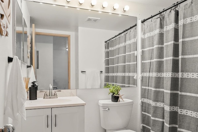 full bathroom with vanity, toilet, and a shower with curtain