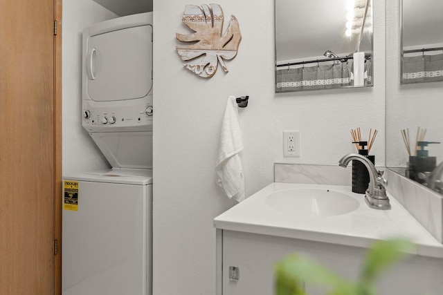 full bathroom featuring stacked washer / dryer and vanity