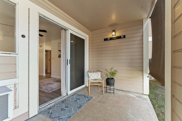 entrance to property with a patio area