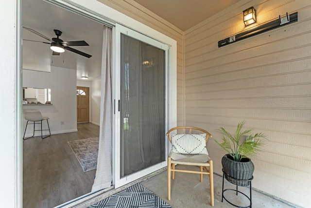 property entrance with ceiling fan