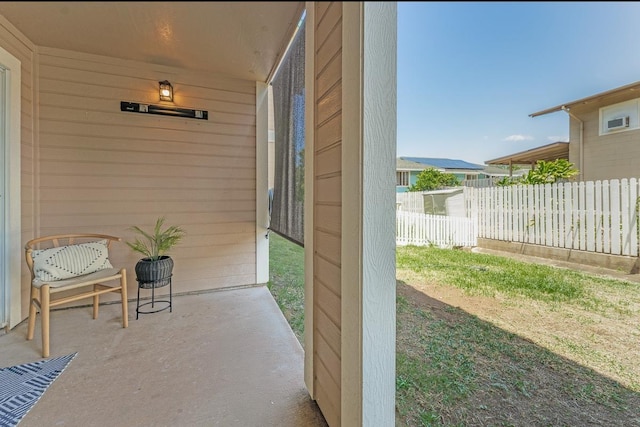 view of patio / terrace featuring fence